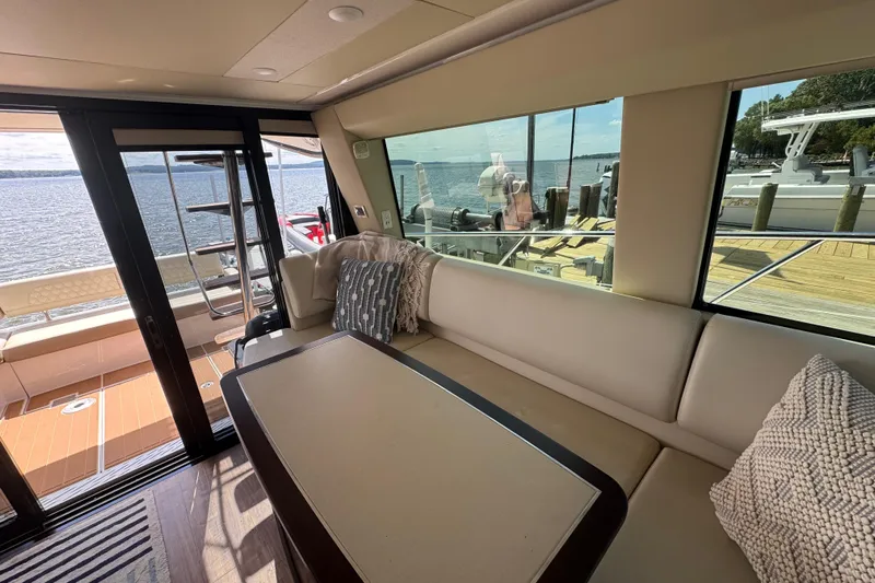 Tomtanic Yacht Photos Pics Luxurious interior of 2019 Regal 42 Fly yacht with waterfront view.