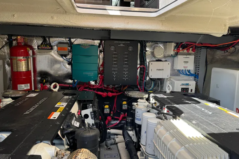 Tomtanic Yacht Photos Pics Engine room of a 2019 Regal 42 Fly yacht, showcasing equipment and wiring.
