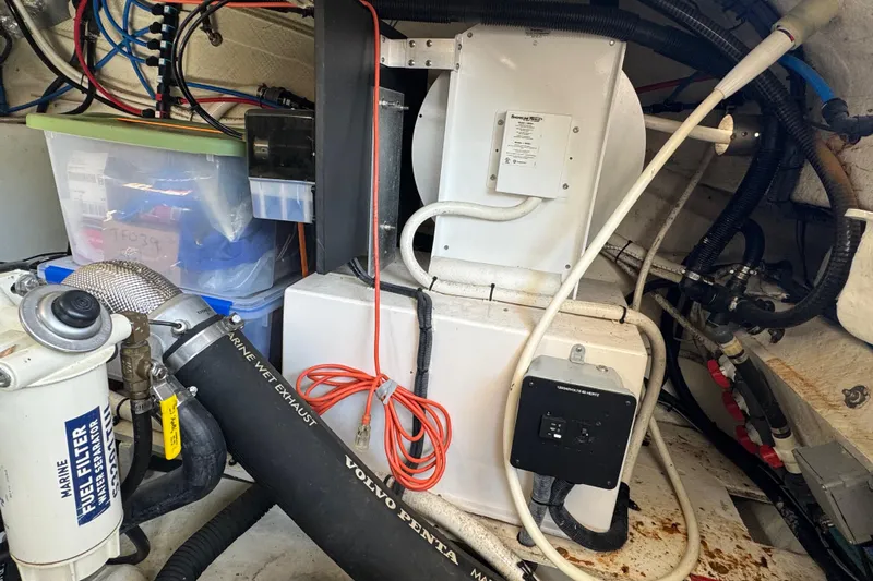 Tomtanic Yacht Photos Pics Engine room of 2019 Regal 42 Fly yacht with mechanical components and wiring.