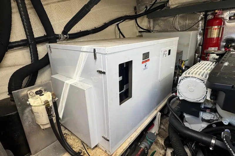 Tomtanic Yacht Photos Pics Engine room of 2019 Regal 42 Fly yacht with generator and equipment.