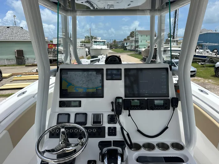  Yacht Photos Pics 2023 Cape Horn 32xs boat dashboard with navigation screens and controls.