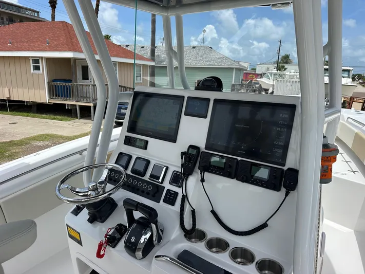  Yacht Photos Pics 2023 Cape Horn 32xs boat console with advanced navigation and communication equipment.