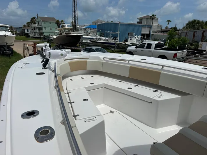  Yacht Photos Pics 2023 Cape Horn 32xs boat with spacious seating, docked in a marina under a cloudy sky.