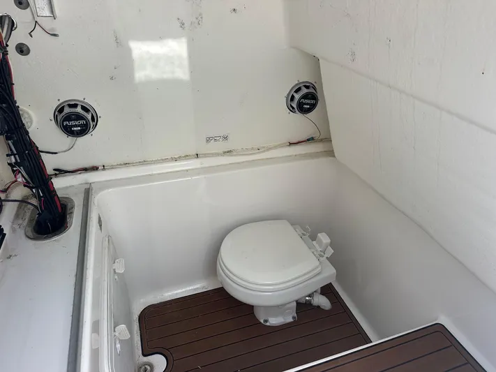  Yacht Photos Pics 2023 Cape Horn 32xs boat interior with toilet and Fusion speakers.