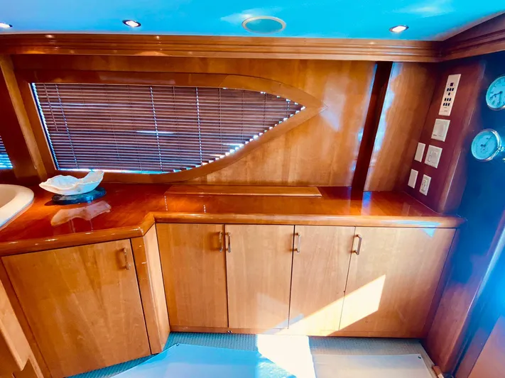  Yacht Photos Pics Luxurious wooden interior of a 2001 Hatteras 60 Convertible yacht with elegant cabinetry.