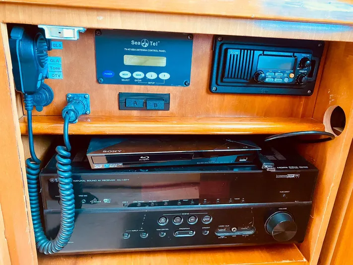  Yacht Photos Pics Electronics panel on 2001 Hatteras 60 Convertible yacht, featuring communication and entertainment systems.