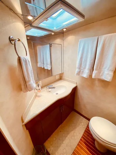  Yacht Photos Pics Luxurious bathroom in 2001 Hatteras 60 Convertible yacht with modern fixtures.