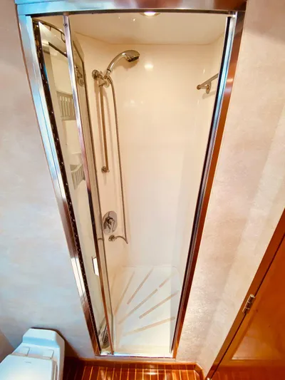  Yacht Photos Pics Shower area in 2001 Hatteras 60 Convertible yacht, featuring sleek design and modern fixtures.