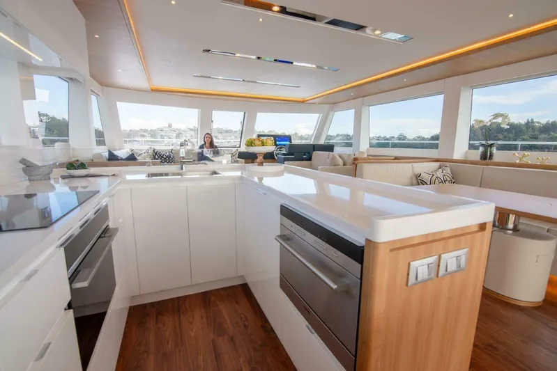 53e Iliad 2026 Yacht Photos Pics Luxurious interior of 2026 ILIAD 53E yacht with modern kitchen and panoramic windows.