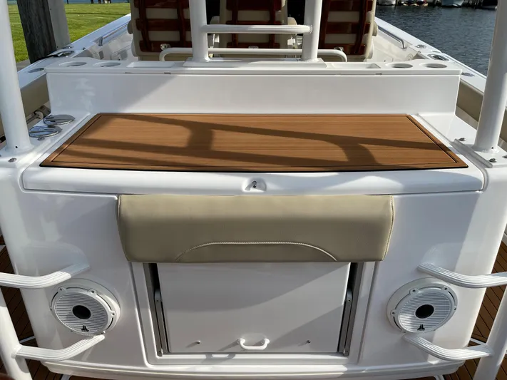  Yacht Photos Pics 2019 Everglades 435 CC boat deck with seating and storage compartments.