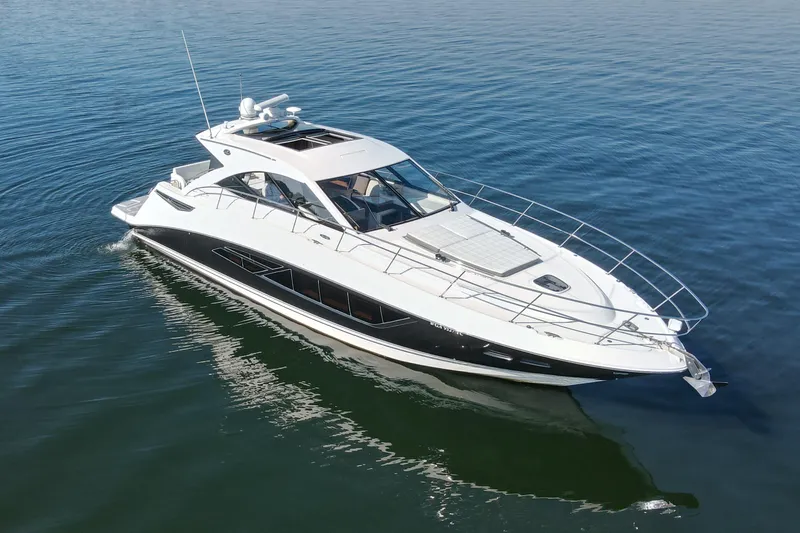 Livin Da Lyfe Yacht Photos Pics 2013 Sea Ray 510 Sundancer luxury yacht cruising on calm blue waters.