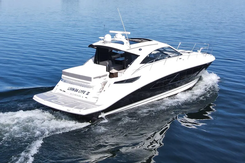 Livin Da Lyfe Yacht Photos Pics 2013 Sea Ray 510 Sundancer yacht cruising on calm blue waters.