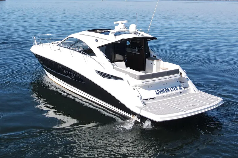 Livin Da Lyfe Yacht Photos Pics 2013 Sea Ray 510 Sundancer yacht cruising on calm blue waters.