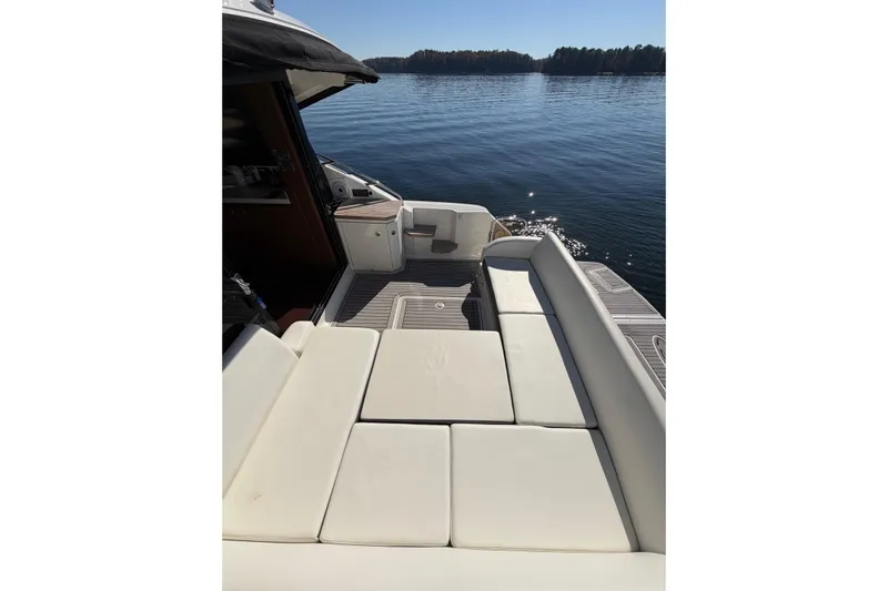 Livin Da Lyfe Yacht Photos Pics 2013 Sea Ray 510 Sundancer yacht with spacious deck seating on calm water.