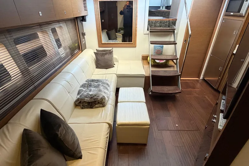 Livin Da Lyfe Yacht Photos Pics Luxurious interior of 2013 Sea Ray 510 Sundancer yacht with plush seating and elegant decor.