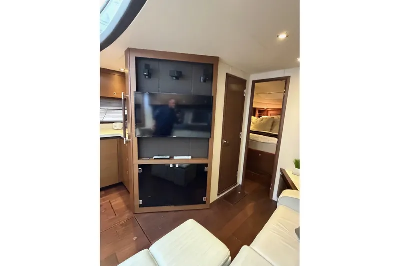 Livin Da Lyfe Yacht Photos Pics Interior of 2013 Sea Ray 510 Sundancer yacht with TV and cozy seating area.