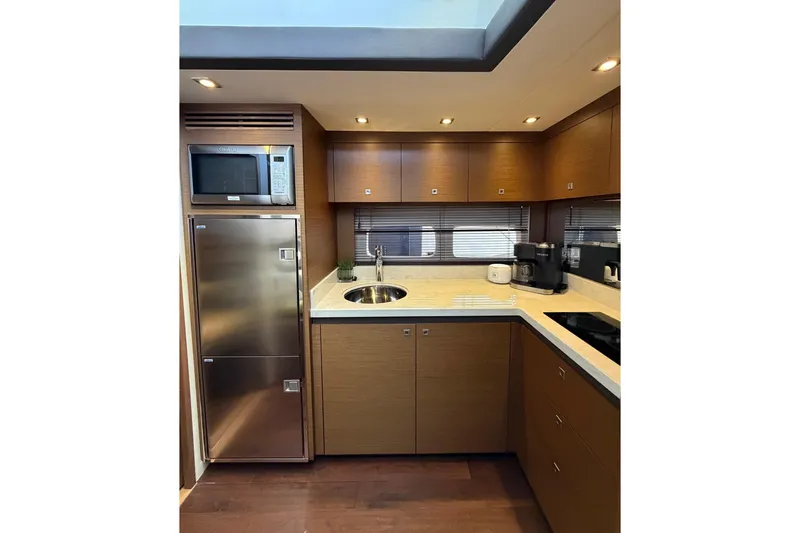 Livin Da Lyfe Yacht Photos Pics Luxurious kitchen interior of 2013 Sea Ray 510 Sundancer yacht with modern appliances.