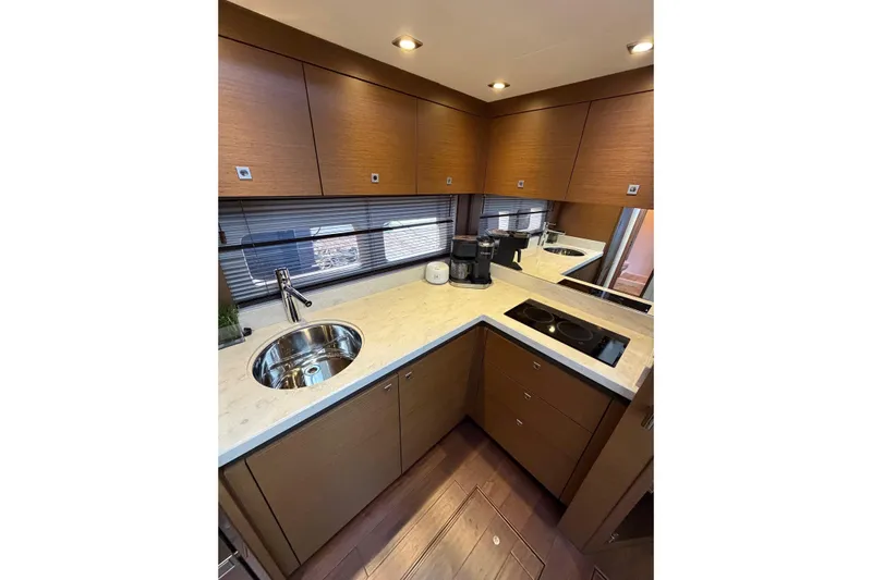 Livin Da Lyfe Yacht Photos Pics Luxurious kitchen interior of 2013 Sea Ray 510 Sundancer yacht with modern amenities.