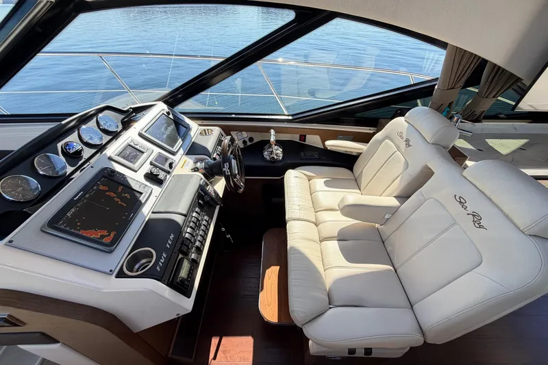Livin Da Lyfe Yacht Photos Pics Luxurious helm of 2013 Sea Ray 510 Sundancer with leather seating and advanced navigation controls.