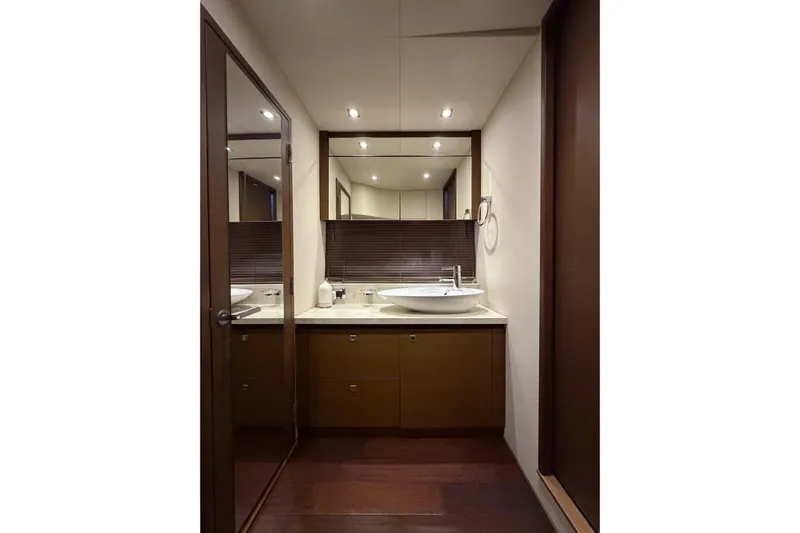 Livin Da Lyfe Yacht Photos Pics Luxurious bathroom interior of 2013 Sea Ray 510 Sundancer yacht, featuring modern sink and mirror.