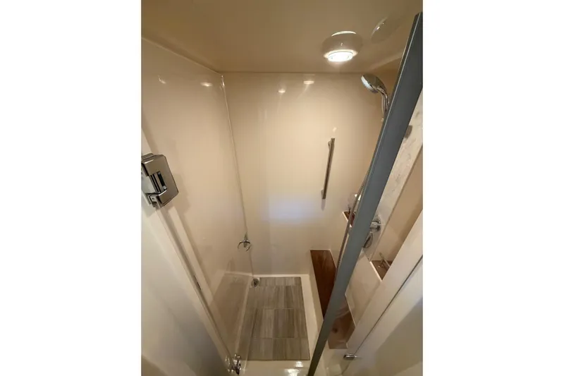 Livin Da Lyfe Yacht Photos Pics Shower area in 2013 Sea Ray 510 Sundancer yacht, featuring modern fixtures and sleek design.