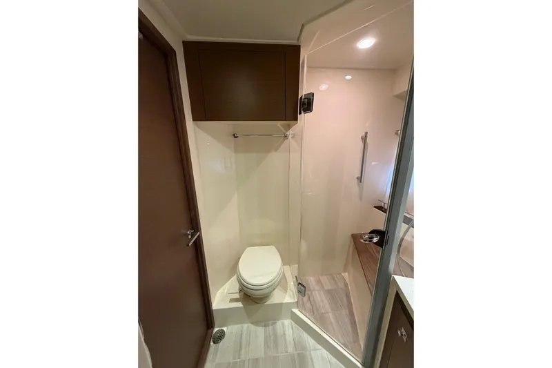 Livin Da Lyfe Yacht Photos Pics Bathroom interior of 2013 Sea Ray 510 Sundancer yacht with shower and toilet.