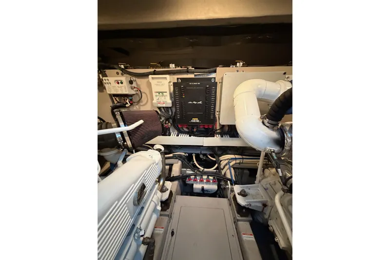 Livin Da Lyfe Yacht Photos Pics Engine room of 2013 Sea Ray 510 Sundancer yacht, showcasing mechanical components and systems.
