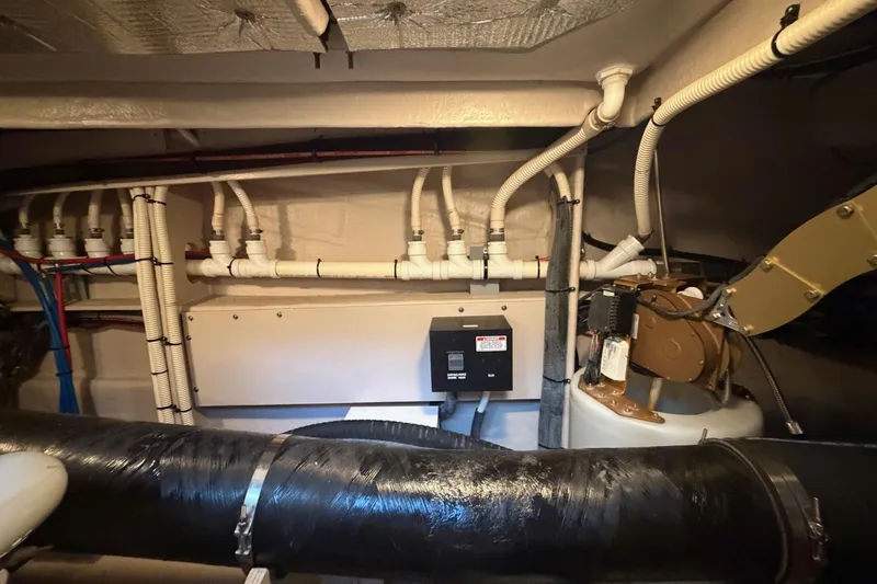 Livin Da Lyfe Yacht Photos Pics Engine room of 2013 Sea Ray 510 Sundancer with visible piping and machinery.