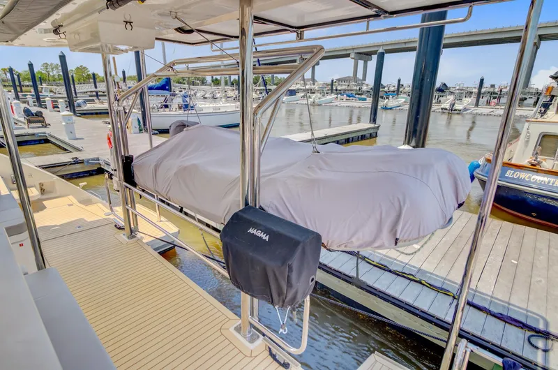 Latidoods Yacht Photos Pics Covered boat on Leopard 42 catamaran docked at marina, 2021 model.