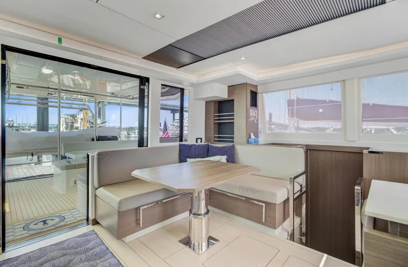 Latidoods Yacht Photos Pics Modern interior of 2021 Leopard 42 yacht with spacious seating and large windows.