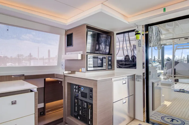 Latidoods Yacht Photos Pics Interior of 2021 Leopard 42 yacht featuring modern kitchen and navigation equipment.