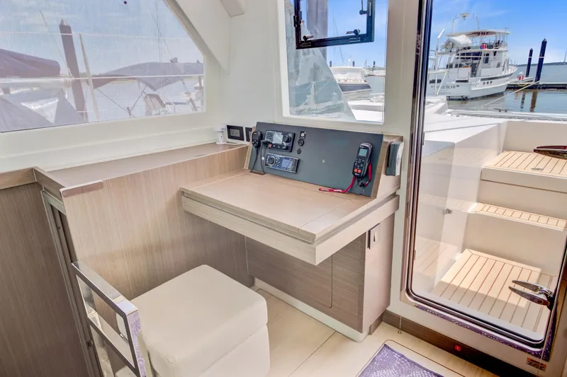 Latidoods Yacht Photos Pics Modern Leopard 42 yacht interior with navigation station, featuring sleek design and marina view.