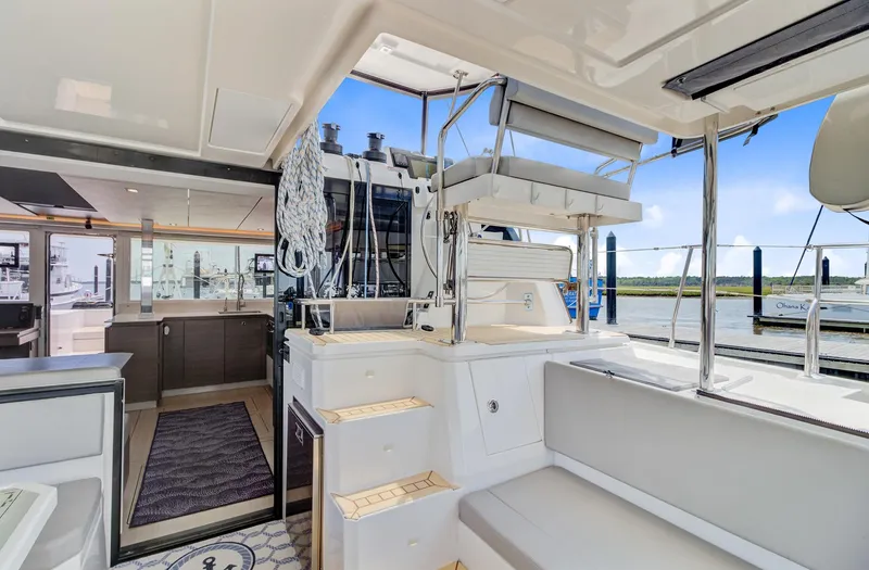 Latidoods Yacht Photos Pics Luxurious 2021 Leopard 42 yacht interior with modern seating and open deck view.