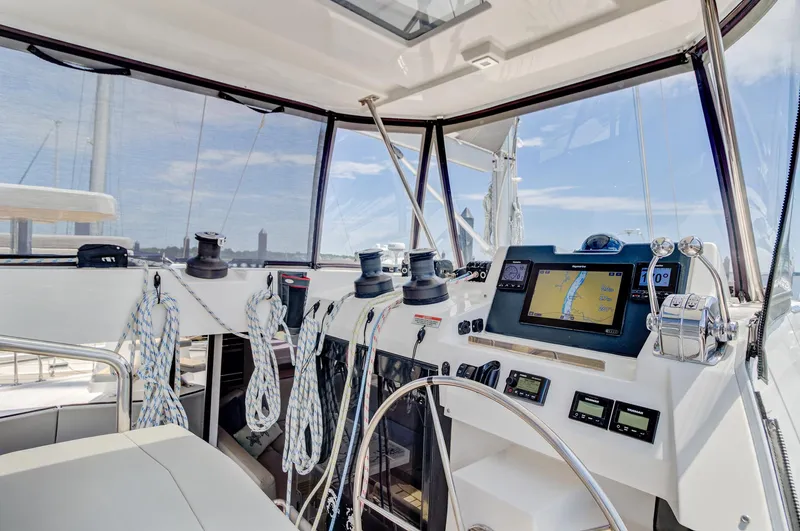 Latidoods Yacht Photos Pics Cockpit of 2021 Leopard 42 yacht with navigation equipment and ropes.