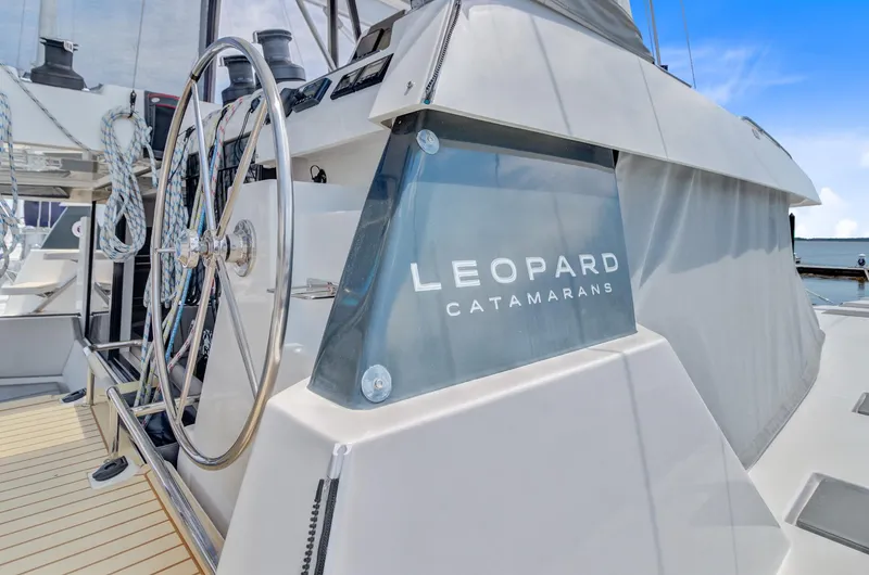 Latidoods Yacht Photos Pics Leopard 42 catamaran helm with steering wheel, 2021 model, sleek design.