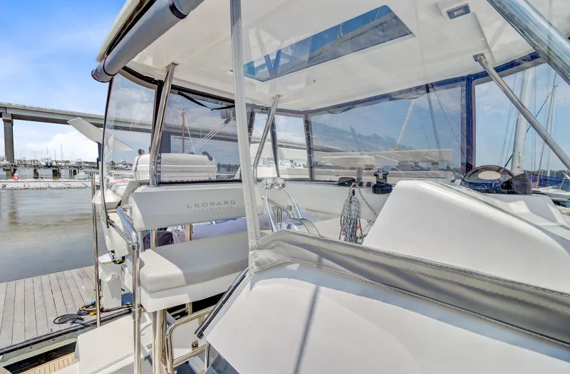 Latidoods Yacht Photos Pics Modern Leopard 42 yacht cockpit, 2021 model, docked at marina with clear skies.