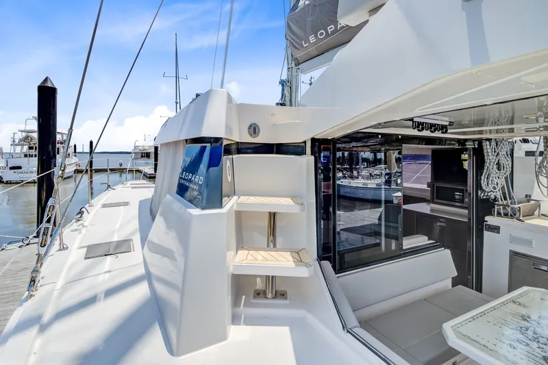 Latidoods Yacht Photos Pics Modern Leopard 42 catamaran, 2021 model, docked at marina with sleek design and spacious deck.