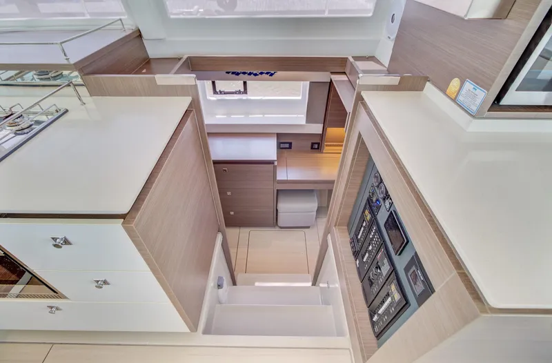 Latidoods Yacht Photos Pics Modern interior of 2021 Leopard 42 yacht with sleek cabinetry and control panels.