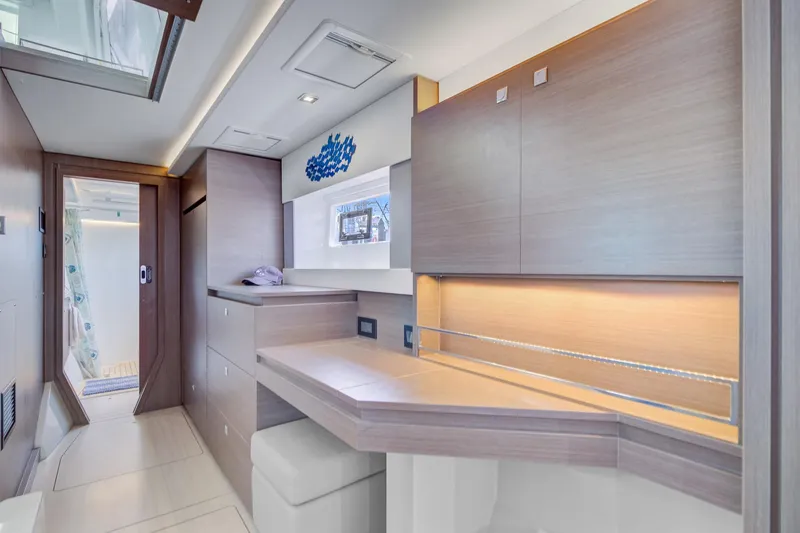 Latidoods Yacht Photos Pics Modern interior of 2021 Leopard 42 yacht with sleek wood finishes and ambient lighting.