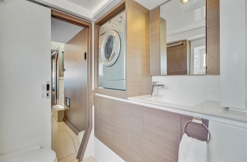 Latidoods Yacht Photos Pics Modern bathroom with washer-dryer in 2021 Leopard 42 yacht.