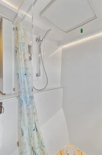 Latidoods Yacht Photos Pics Modern shower area in 2021 Leopard 42 yacht with sleek design and curtain.