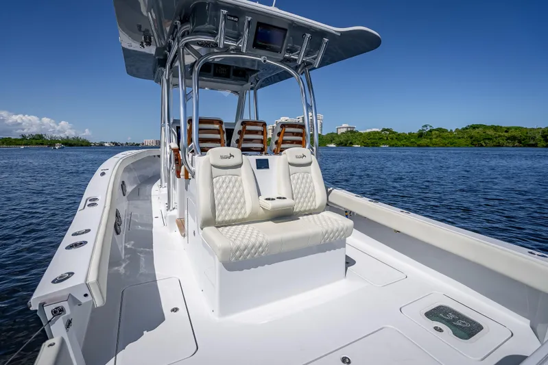  Yacht Photos Pics 2027 Billfish 39 boat with sleek design on calm water, featuring luxurious seating and modern amenities.
