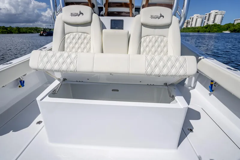 Yacht Photos Pics Luxurious seating on 2027 Billfish 39 boat, featuring diamond-stitched upholstery and storage compartment.