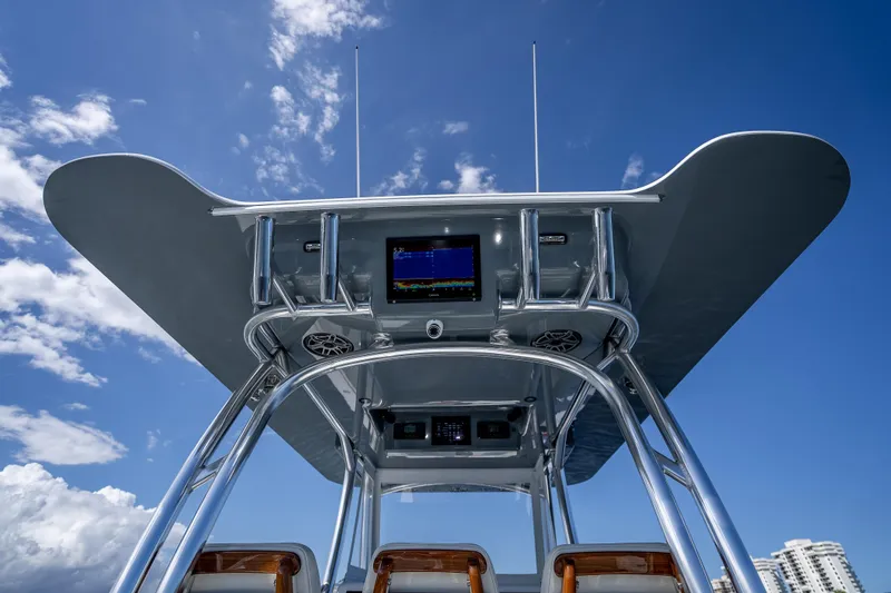  Yacht Photos Pics 2027 Billfish 39 boat console with advanced navigation system under clear blue sky.