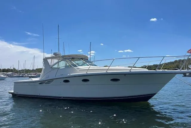 Moxie Yacht Photos Pics 1998 Tiara Yachts 3500 Open boat on water under clear blue sky.