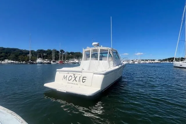 Moxie Yacht Photos Pics 1998 Tiara Yachts 3500 Open boat named "Moxie" docked in a marina.
