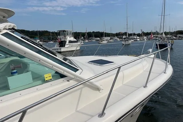 Moxie Yacht Photos Pics 1998 Tiara Yachts 3500 Open docked in a marina with other boats.