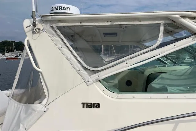 Moxie Yacht Photos Pics 1998 Tiara Yachts 3500 Open boat with Simrad equipment, docked in a marina.