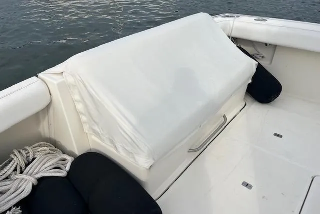 Moxie Yacht Photos Pics 1998 Tiara Yachts 3500 Open boat deck with covered seating and nautical ropes.