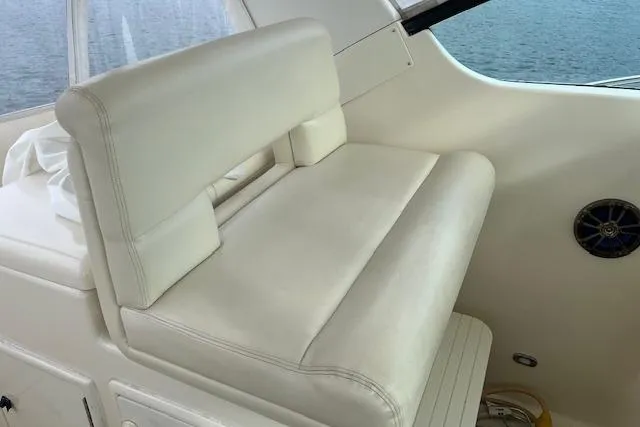 Moxie Yacht Photos Pics 1998 Tiara Yachts 3500 Open interior with white leather seating and ocean view.